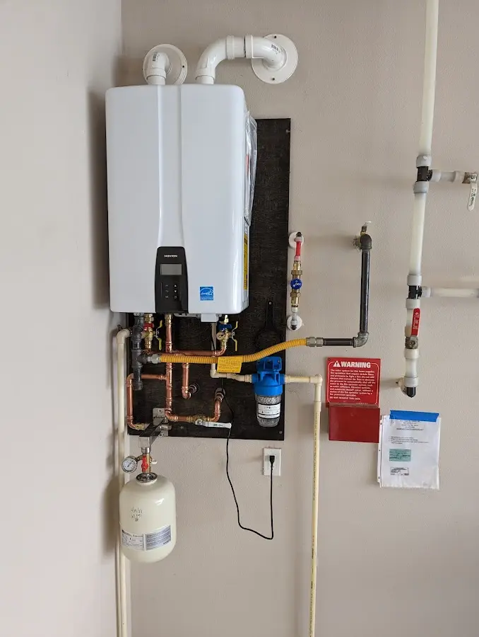 Professional plumber installing copper piping in a Boiling Spring Lakes home